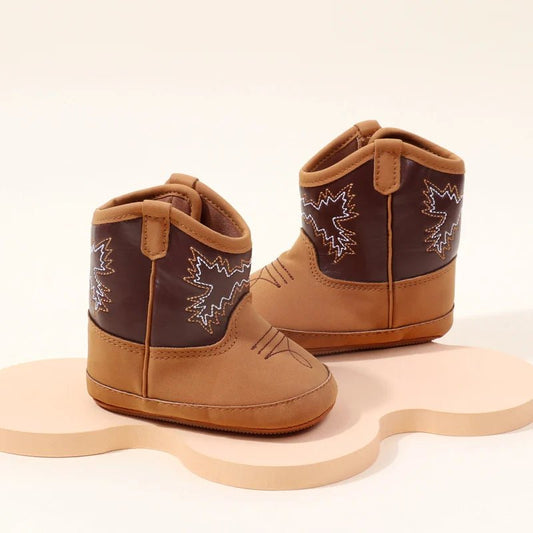 Little boots for babies crafted with soft materials and non slip soles, offering safe, snug, and protected steps for infants learning to walk with comfort and style.
