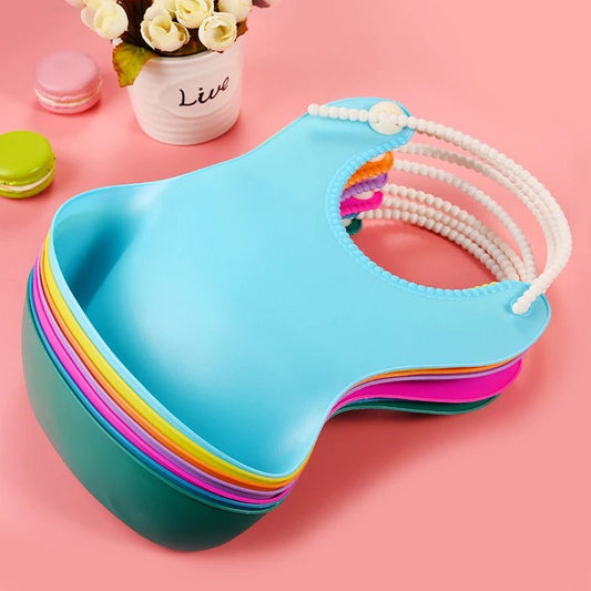 Newborn baby bibs made of waterproof EVA keep infants dry and comfortable during mealtime while featuring cute cartoon designs for everyday use.