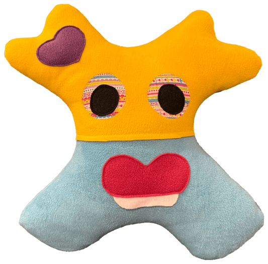 Soft handmade Amiba pillow designed for slump free child travel naps