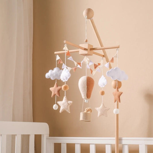 Felt baby crib mobile featuring calming melodies designed to relax infants, offering gentle sound and motion to create a serene nursery environment.