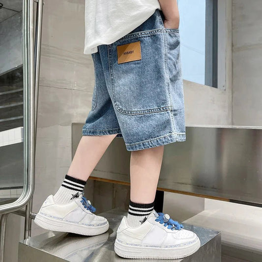 The Stylish Kids Denim Shorts provide breathable comfort and durability, keeping children cool and fashionable for summer play and outings.